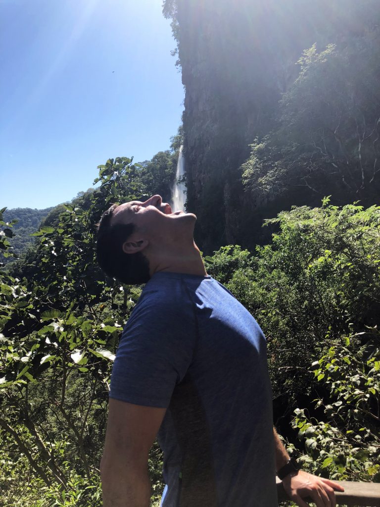 Damian drinking waterfall
